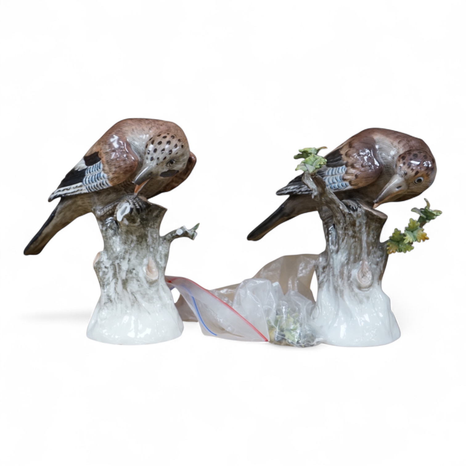 A pair of Meissen style porcelain models of Jays, 18cm